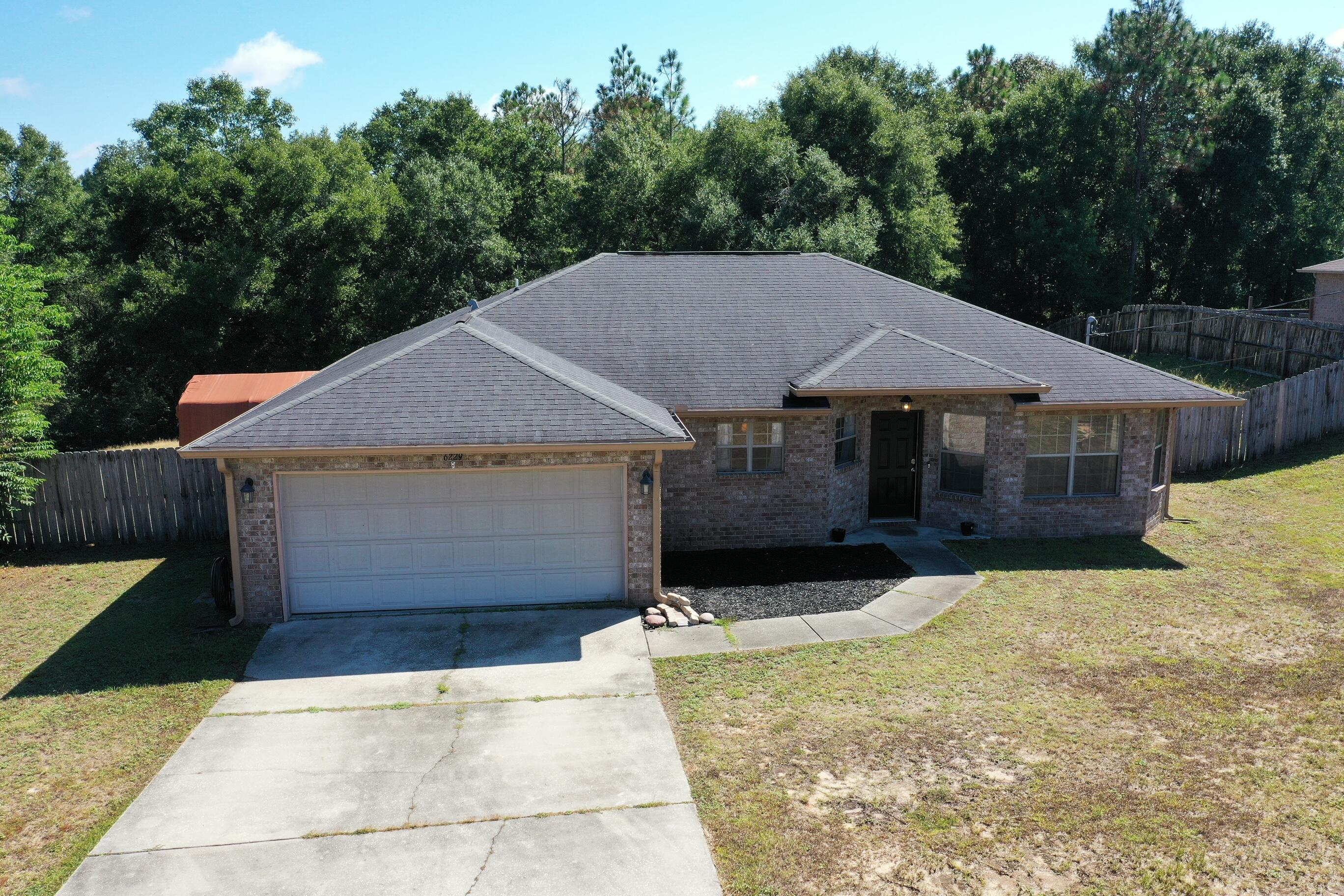 6229 Flash Lane Crestview, FL 32536 - Photo 4 of 51 a house with trees in the background