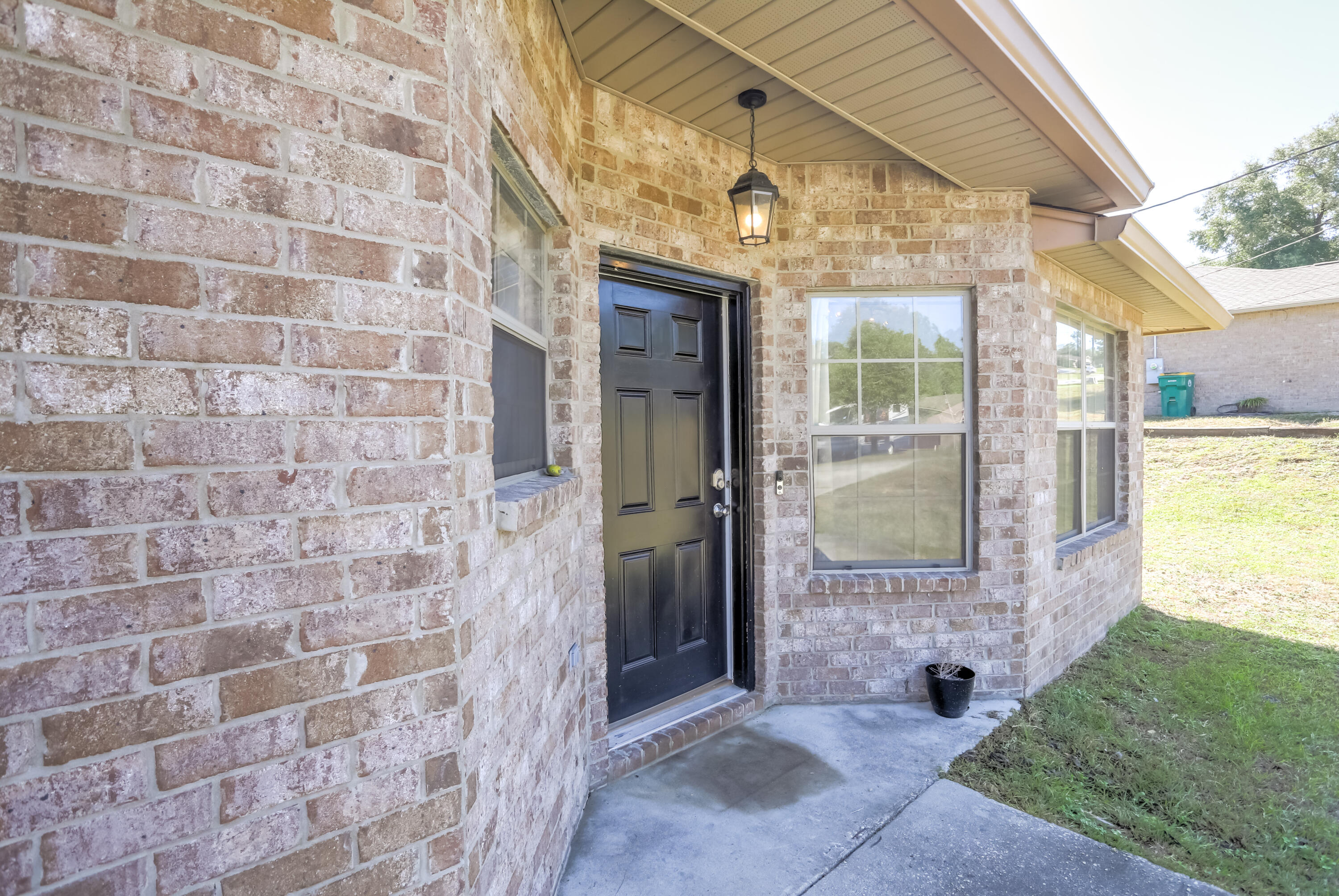 6229 Flash Lane Crestview, FL 32536 - Photo 5 of 51 a view of a brick house with a large window
