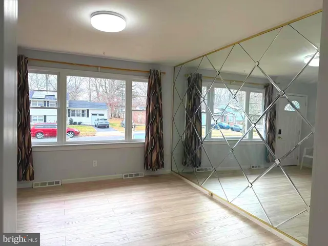 a view of room with window and furniture