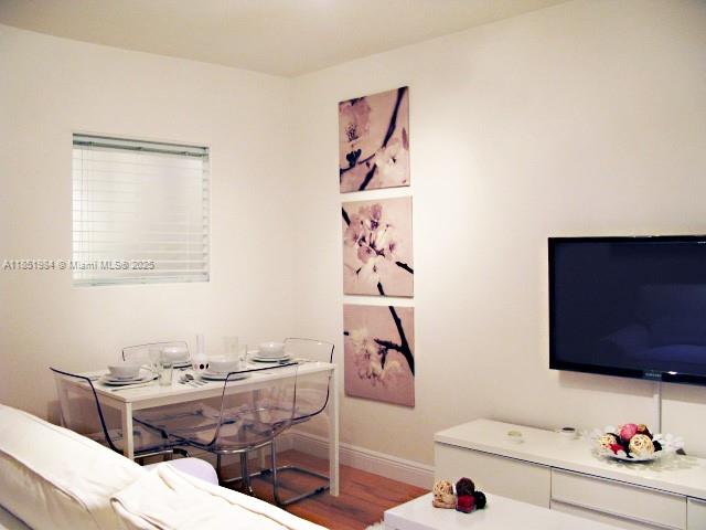 921 Meridian Avenue, Unit 9 Miami Beach, FL 33139 - Photo 1 of 17 a room that has a couch and a table in it