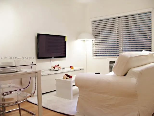 a bathroom with a bathtub sink and mirror