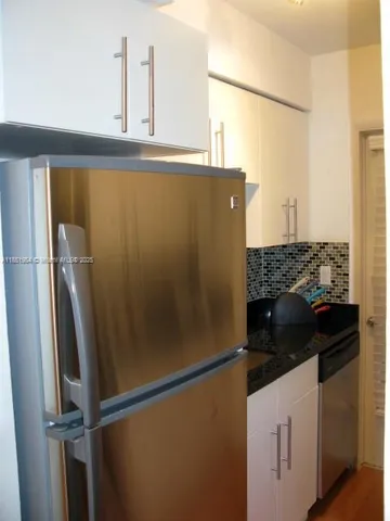 a close view of a refrigerator and window