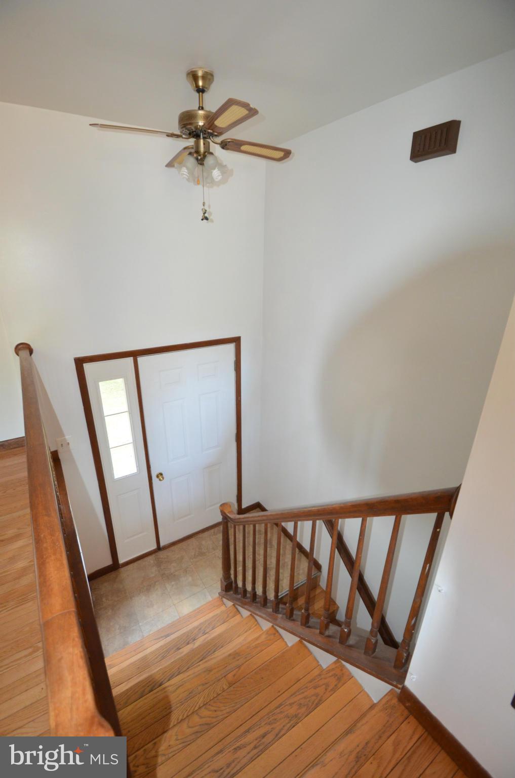 1403 Pleasant View Road Tuscarora, MD 21790 - Photo 8 of 13 a view of staircase with wooden floor and fan