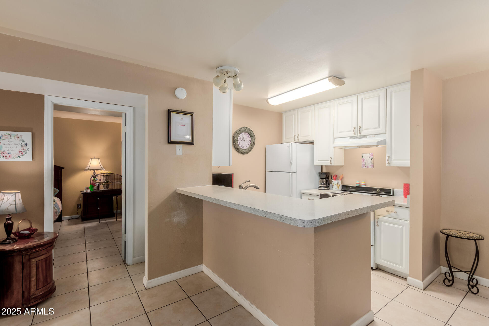 a kitchen with a sink cabinets and window