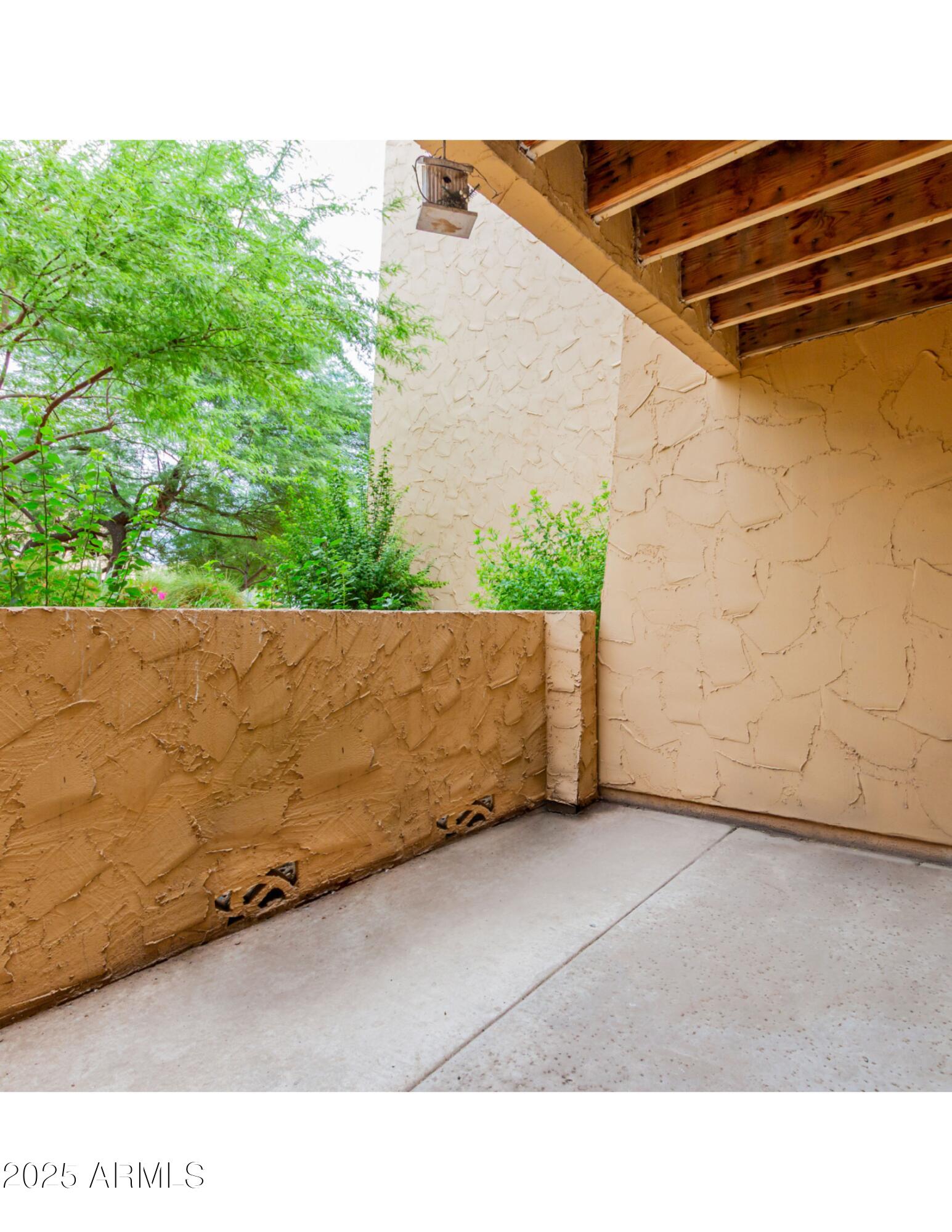 8055 East Thomas Road, Unit C104 Scottsdale, AZ 85251 - Photo 12 of 24 a backyard of a house with lots of green space