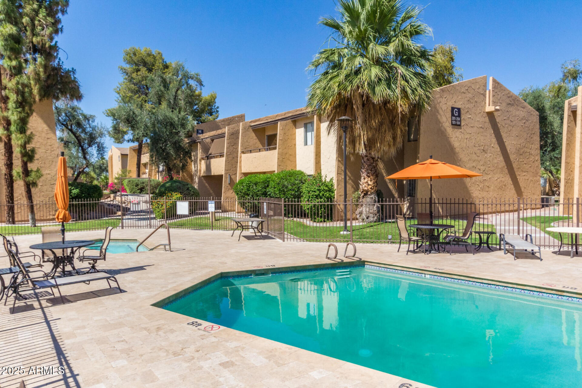 8055 East Thomas Road, Unit C104 Scottsdale, AZ 85251 - Photo 17 of 24 a swimming pool with outdoor seating and yard