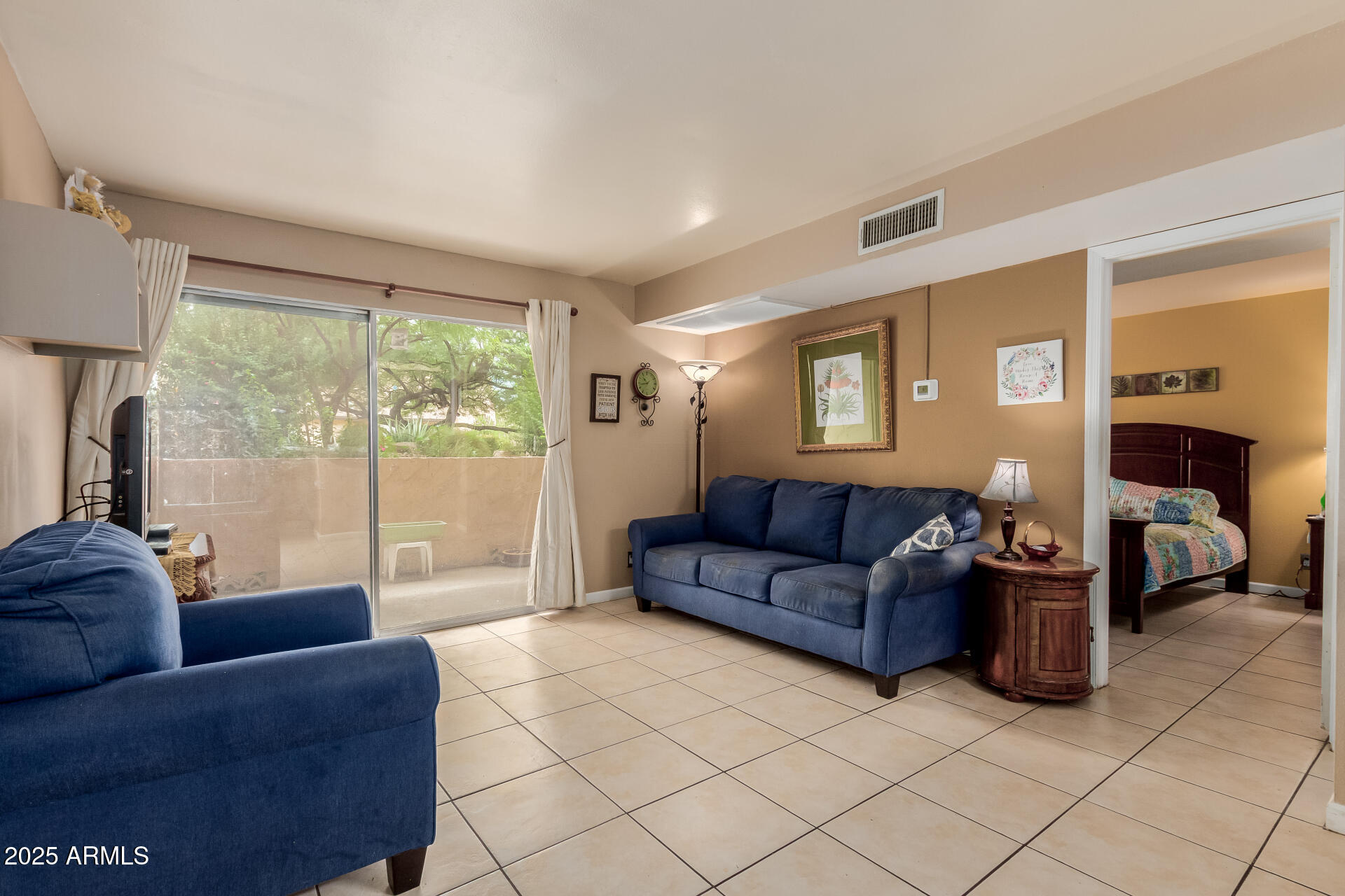 8055 East Thomas Road, Unit C104 Scottsdale, AZ 85251 - Photo 4 of 24 a living room with furniture and a large window