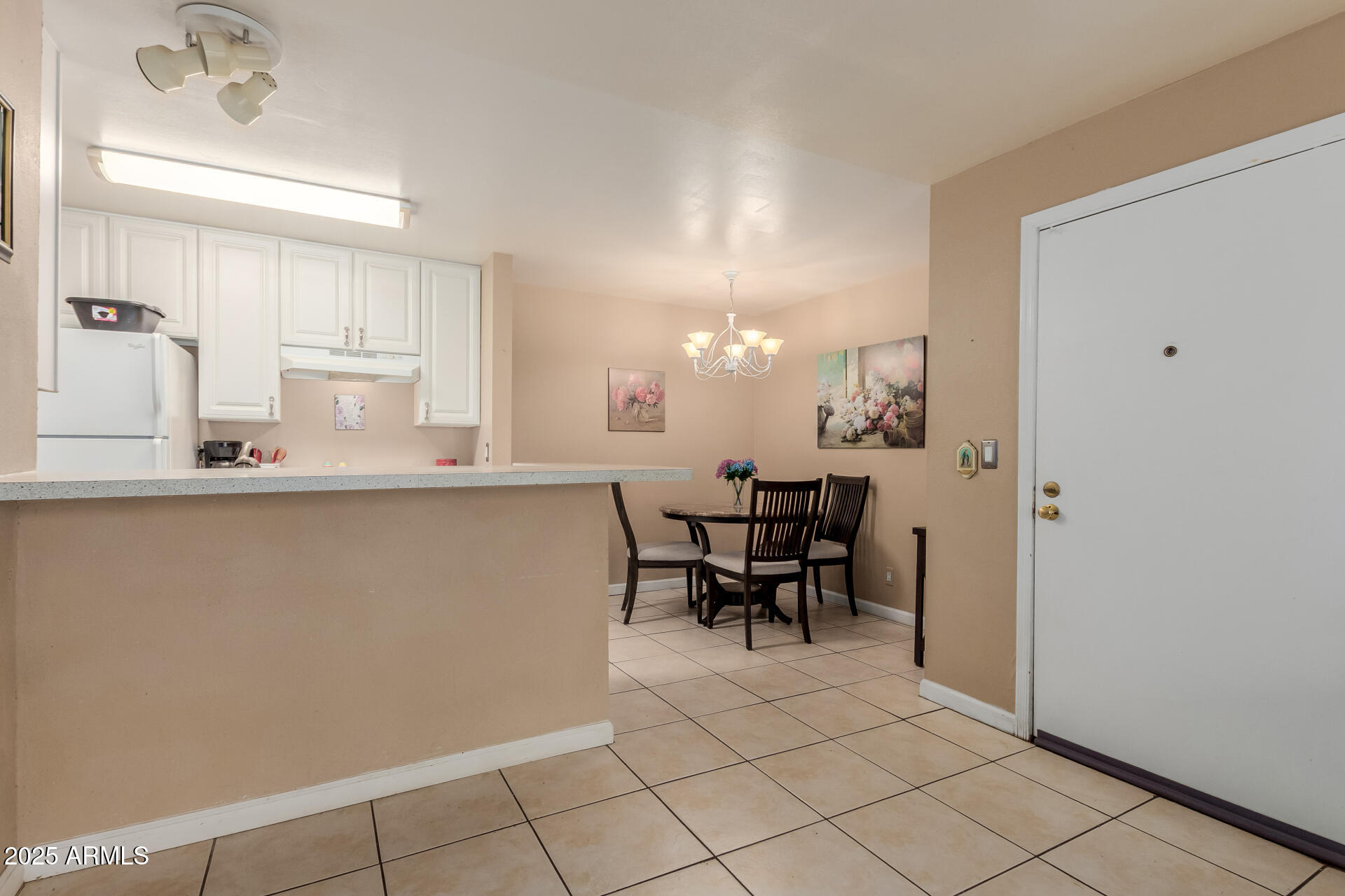 8055 East Thomas Road, Unit C104 Scottsdale, AZ 85251 - Photo 5 of 24 a dining hall with a dining table and chairs