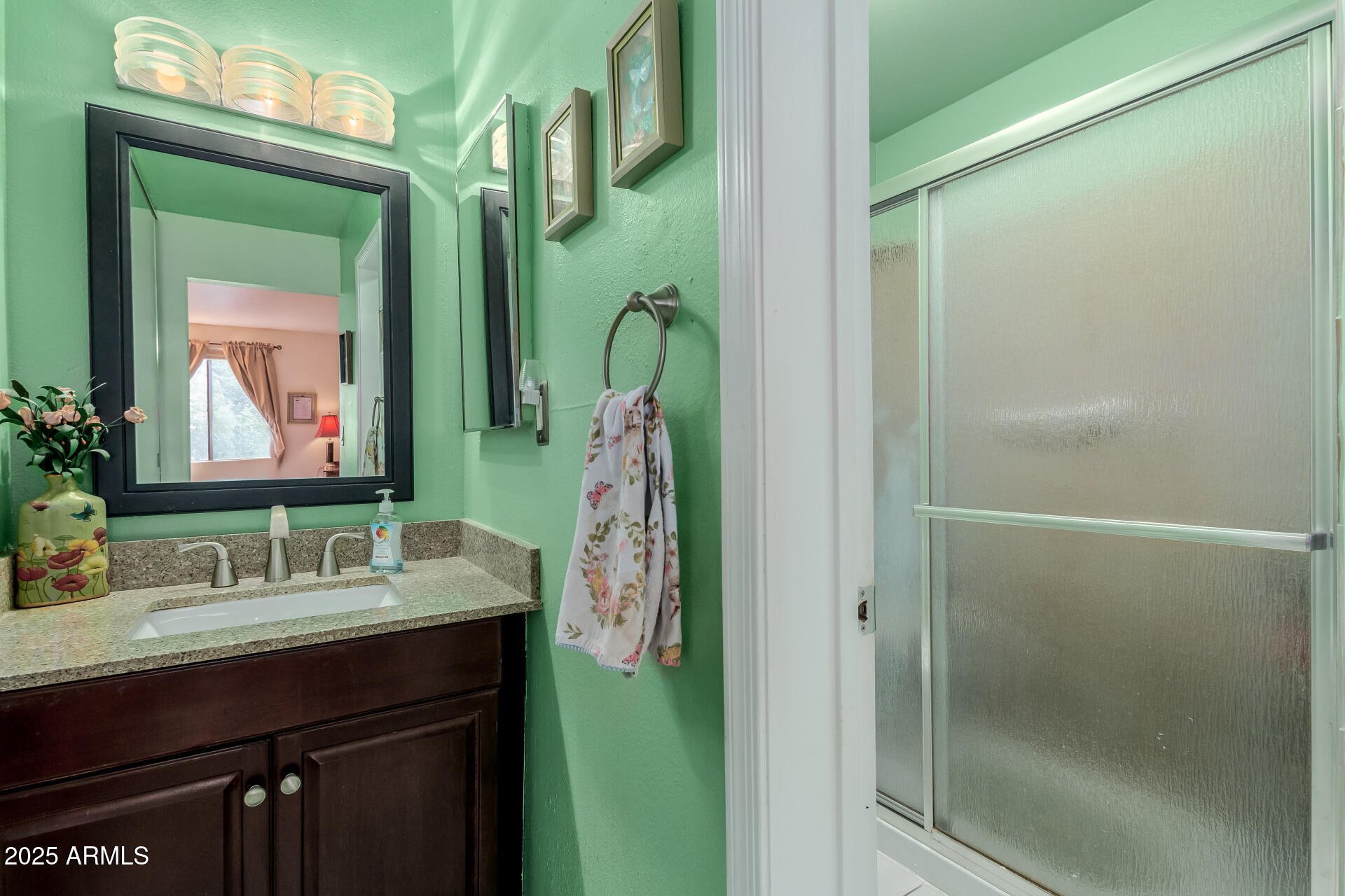 8055 East Thomas Road, Unit C104 Scottsdale, AZ 85251 - Photo 7 of 24 a bathroom with a sink vanity and a mirror