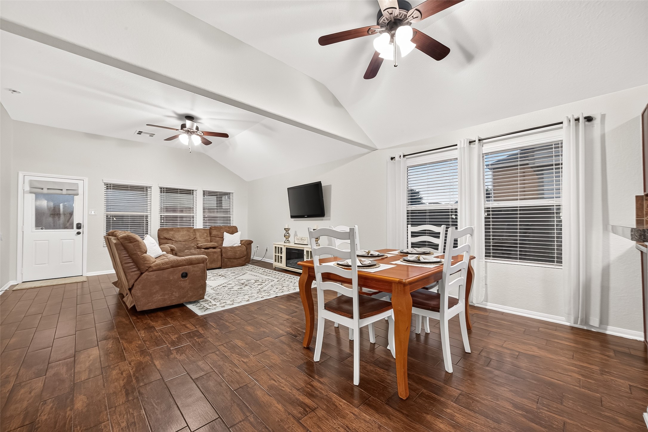 3155 View Valley Trail Katy, TX 77493 - Photo 12 of 50 Impressive perspective connecting the dining space and the great room, emphasizing high ceilings and abundant natural light.