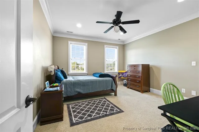 a bedroom with a bed furniture and a window