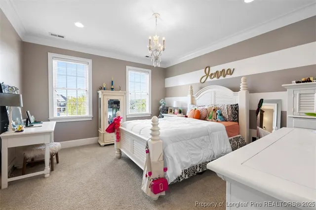 a bed room with bed and a chandelier