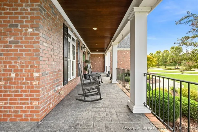 a view of a backyard with sitting area