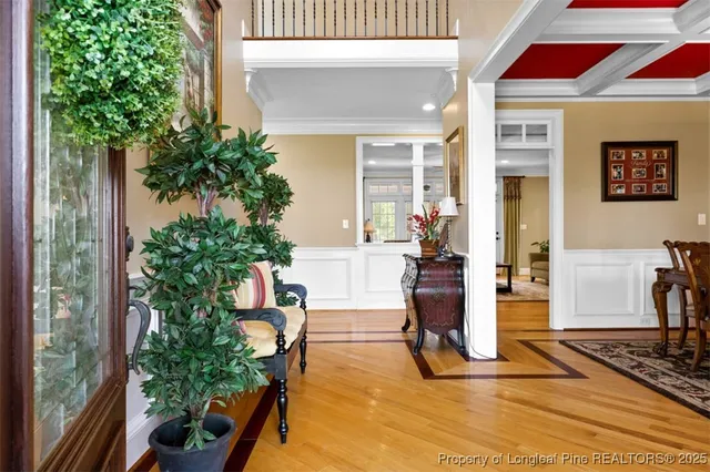 a view of living room filled with furniture and flowers