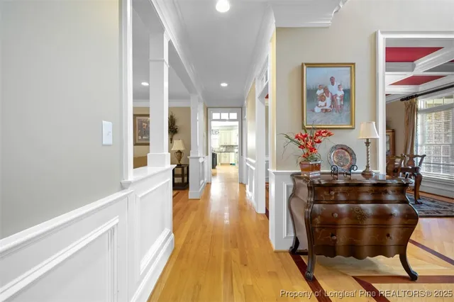 a dining room with furniture and wooden floor