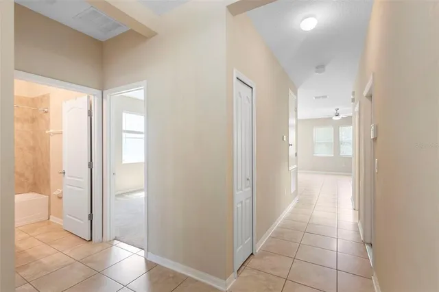 a bathroom with a glass door shower and a sink