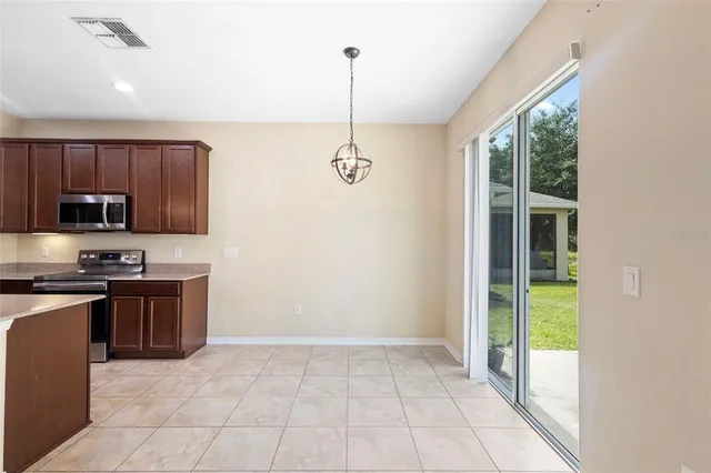 a view of a kitchen with electric appliances