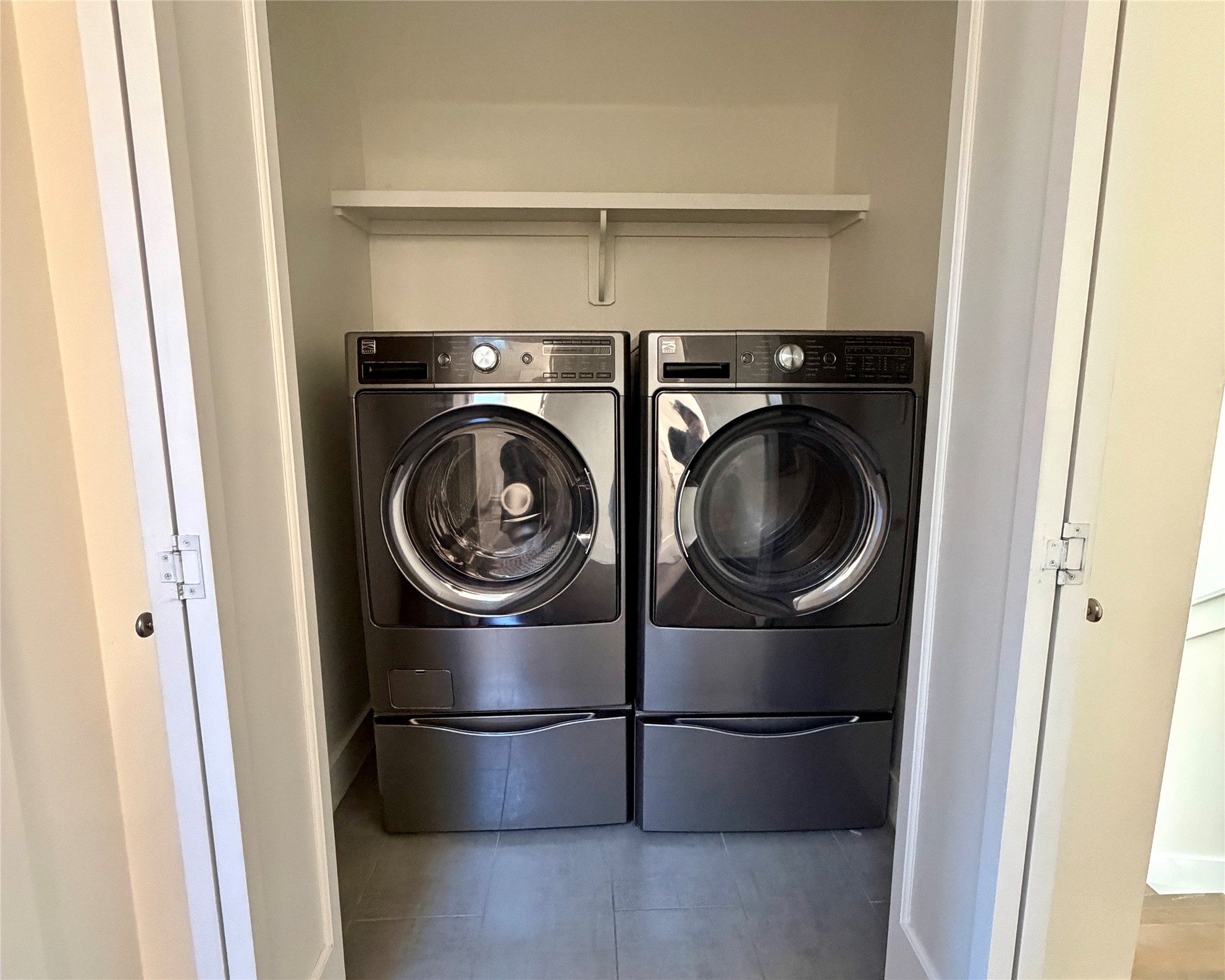 1515 Hether Street, Unit B Austin, TX 78704 - Photo 26 of 30 A dedicated laundry closet with convenient shelving simplifies household chores.