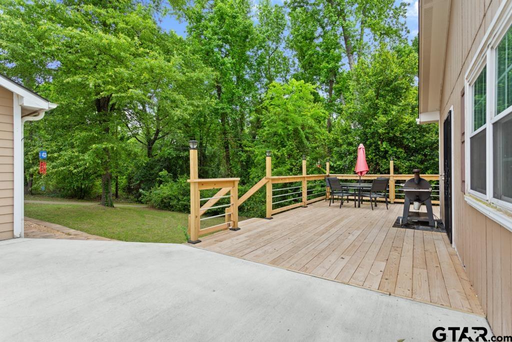 448 North Hill Road Tyler, TX 75706 - Photo 25 of 30 a view of backyard with deck and trees