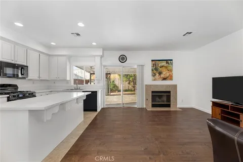 a large kitchen with cabinets a sink and a stove