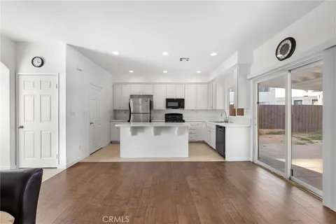 a view of kitchen with stainless steel appliances refrigerator oven and microwave