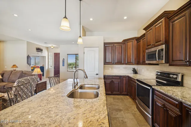 a kitchen with a sink stove and refrigerator