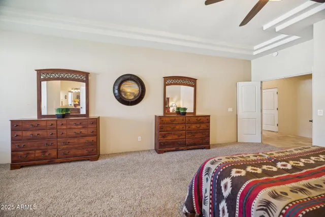 a bathroom with a granite countertop sink a large mirror and vanity