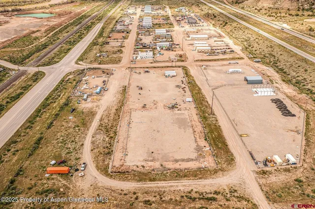 a view of water heater and covered with wooden fence
