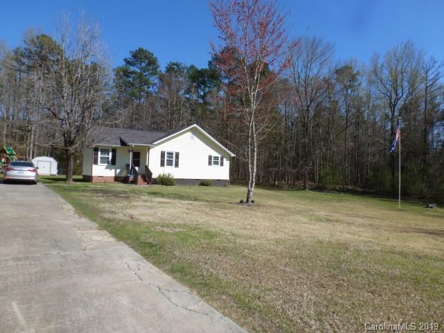 2510 State Rd S-29-305 Lancaster, SC 29720 - Photo 15 of 27 a front view of a house with a yard and garage