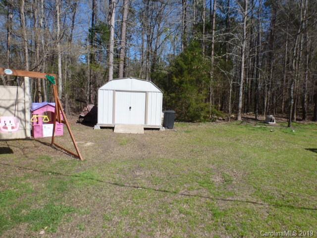2510 State Rd S-29-305 Lancaster, SC 29720 - Photo 18 of 27 a backyard of a house with table and chairs