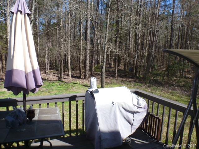 2510 State Rd S-29-305 Lancaster, SC 29720 - Photo 20 of 27 a view of a chairs and table in patio with wooden fence