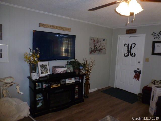 2510 State Rd S-29-305 Lancaster, SC 29720 - Photo 3 of 27 a living room with furniture and a flat screen tv