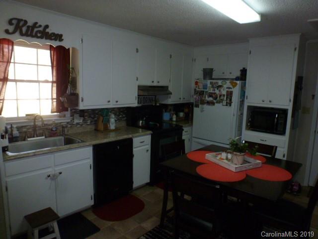 2510 State Rd S-29-305 Lancaster, SC 29720 - Photo 5 of 27 a kitchen with a sink cabinets and window