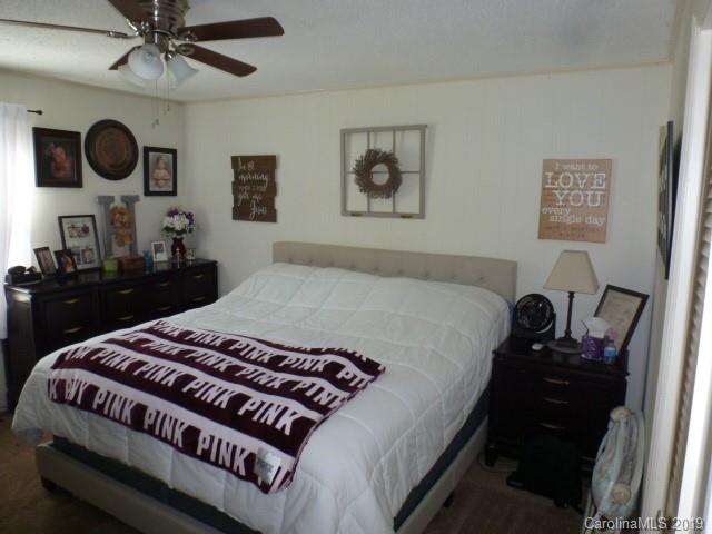 2510 State Rd S-29-305 Lancaster, SC 29720 - Photo 7 of 27 a bedroom with a bed and wooden floor