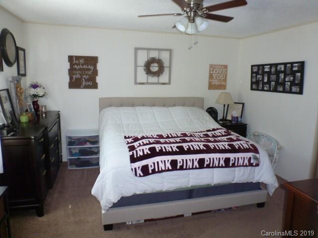 2510 State Rd S-29-305 Lancaster, SC 29720 - Photo 8 of 27 a large bed sitting in a bedroom next to a window