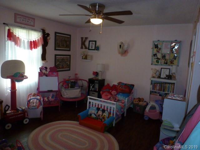 2510 State Rd S-29-305 Lancaster, SC 29720 - Photo 10 of 27 a bedroom with furniture and a lamp