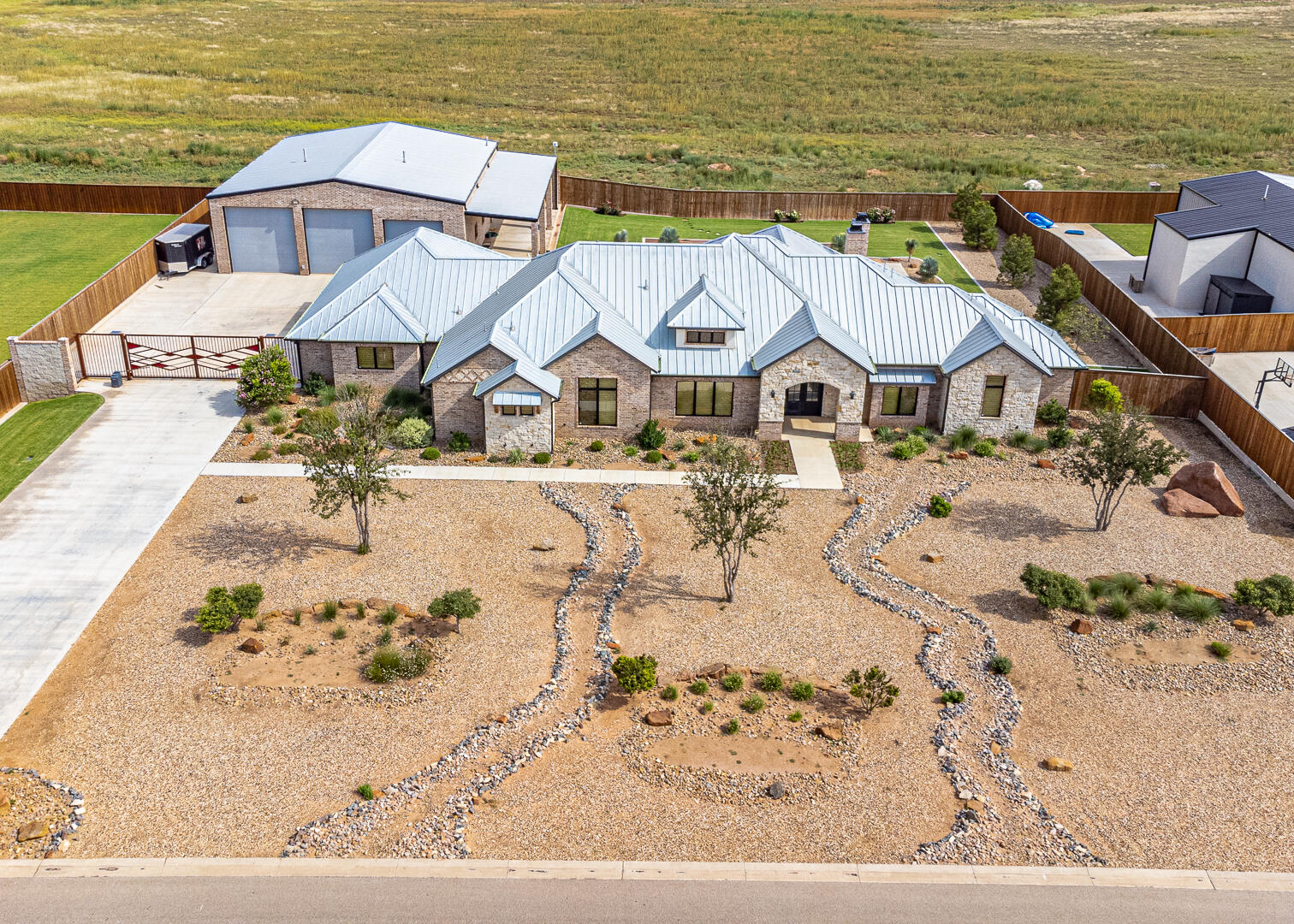an aerial view of a house with a ocean view