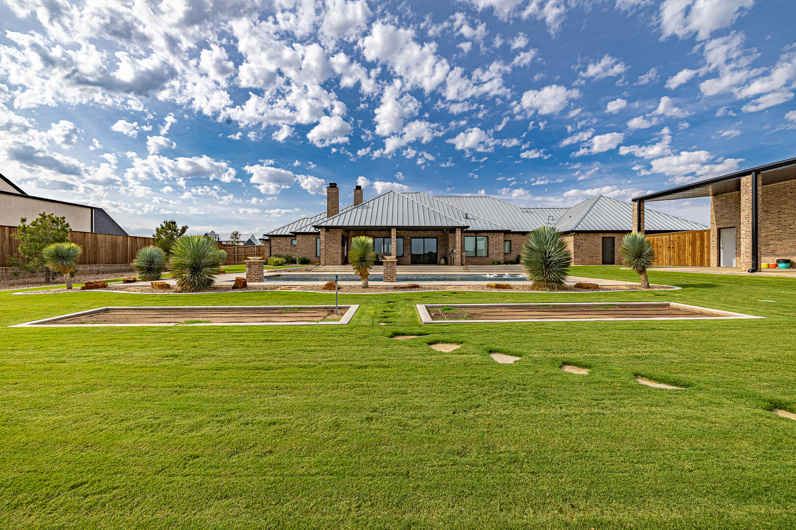 9018 County Road 6850 Lubbock, TX 79407 - Photo 103 of 103 a swimming pool with outdoor seating and yard