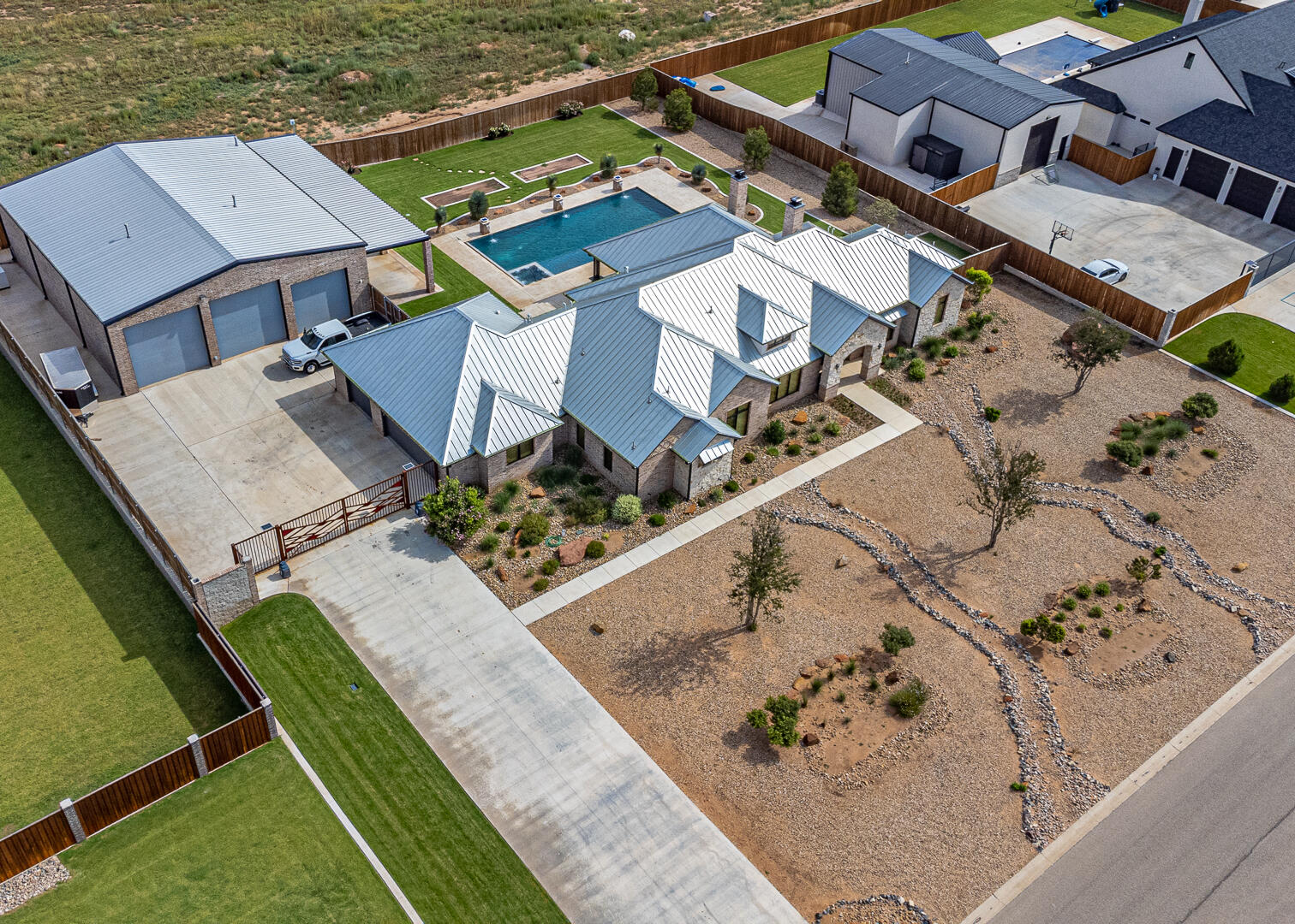 9018 County Road 6850 Lubbock, TX 79407 - Photo 13 of 103 an aerial view of a house with a garden and swimming pool