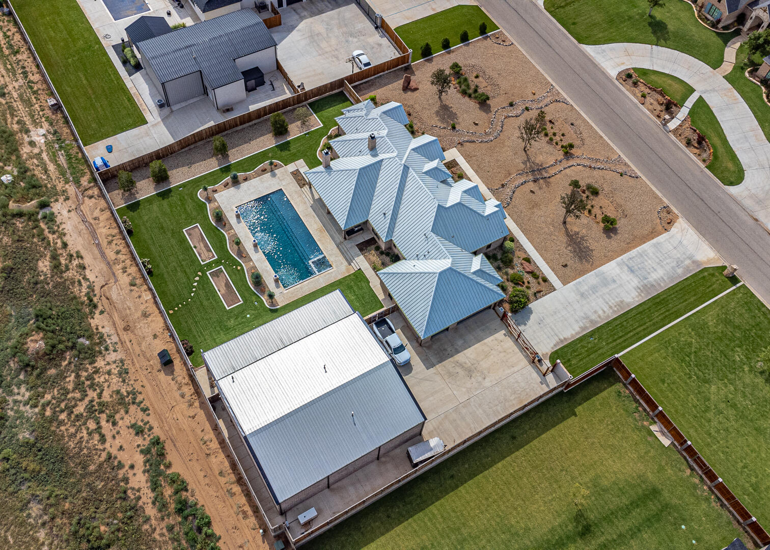 9018 County Road 6850 Lubbock, TX 79407 - Photo 16 of 103 an aerial view of a house with a garden