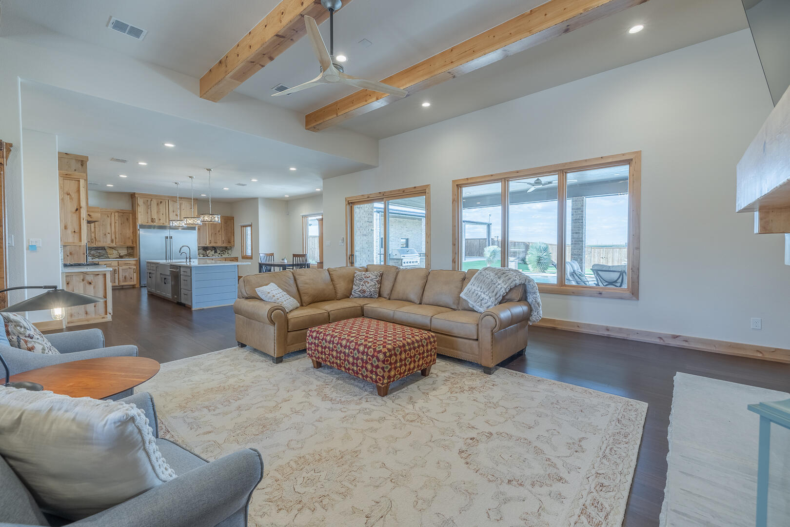 9018 County Road 6850 Lubbock, TX 79407 - Photo 34 of 103 a living room with furniture and a large window