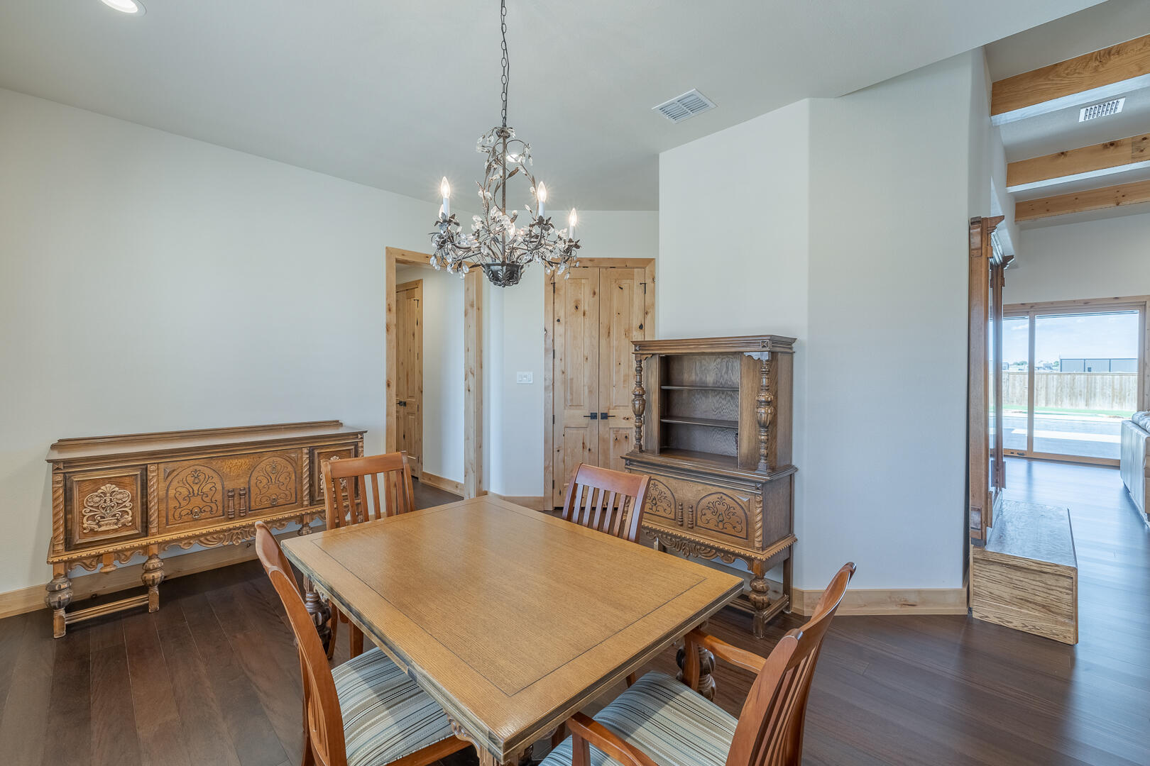 9018 County Road 6850 Lubbock, TX 79407 - Photo 41 of 103 a view of a dining room with furniture and wooden floor