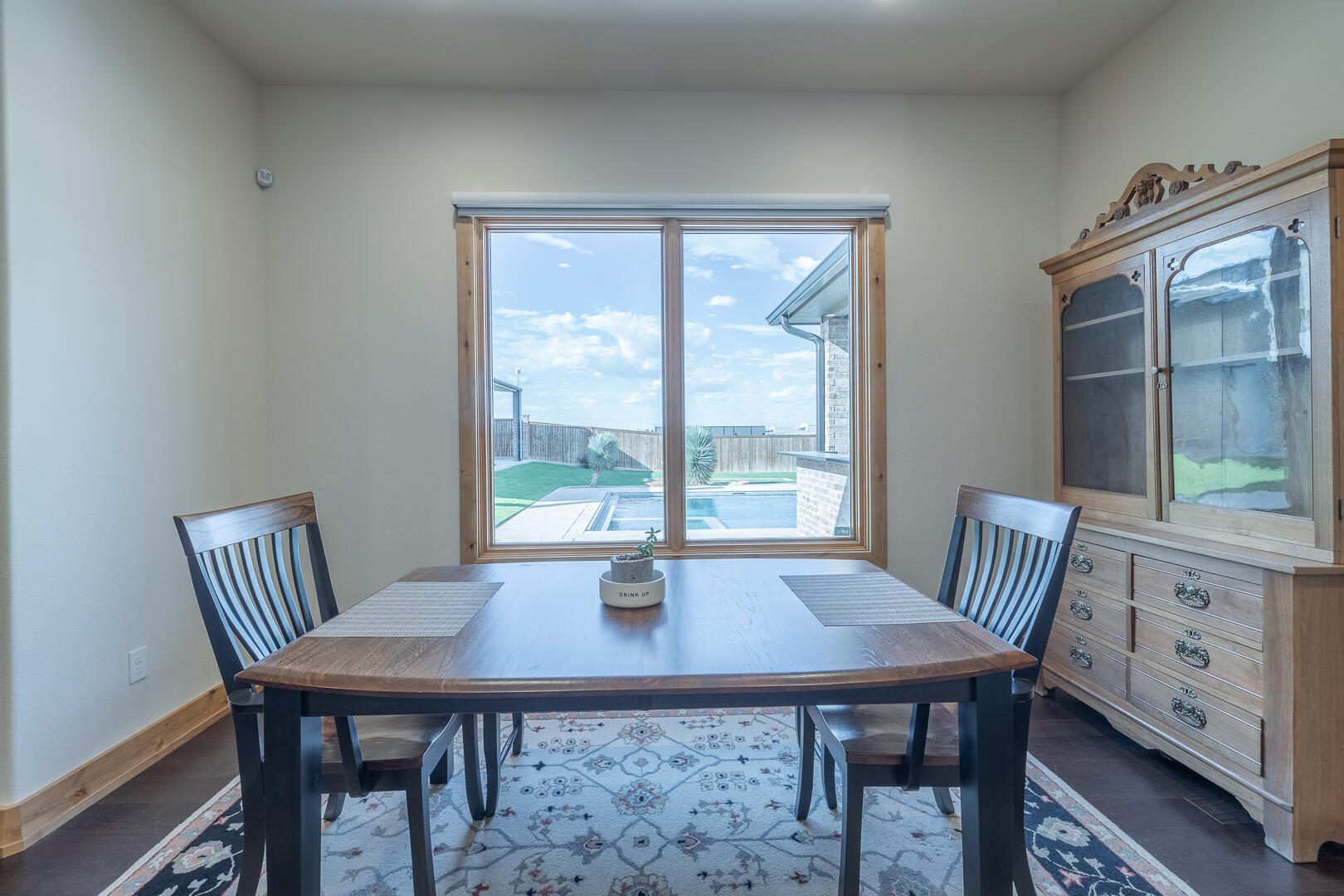 9018 County Road 6850 Lubbock, TX 79407 - Photo 48 of 103 a view of a dining room with furniture and wooden floor