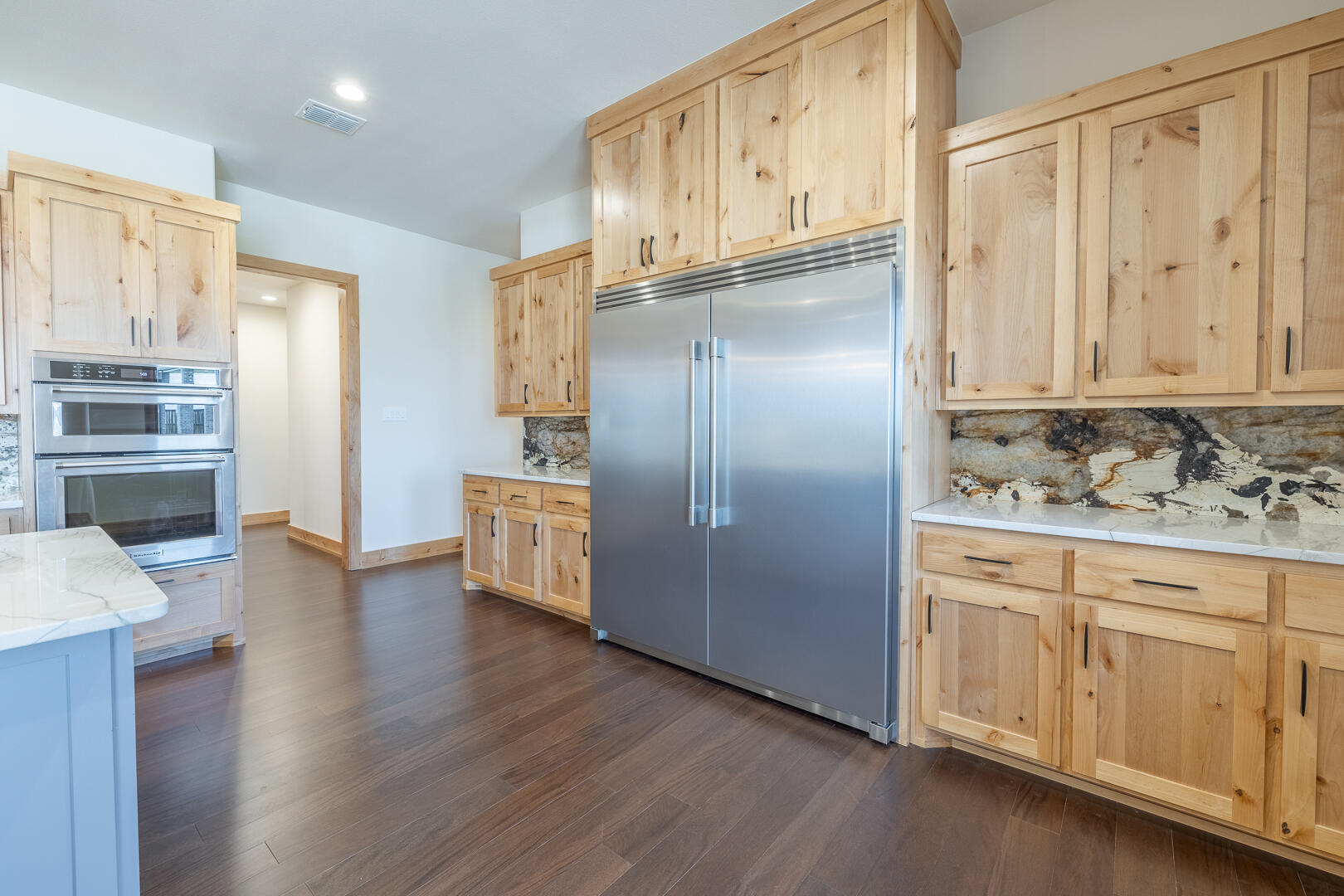 9018 County Road 6850 Lubbock, TX 79407 - Photo 50 of 103 a kitchen with stainless steel appliances granite countertop a refrigerator and a stove top oven