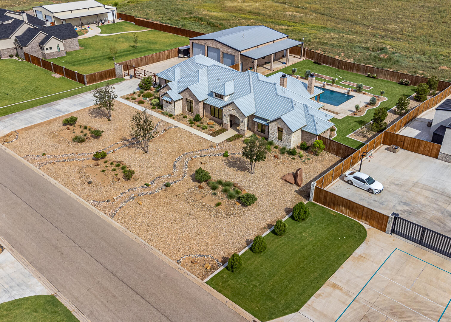 9018 County Road 6850 Lubbock, TX 79407 - Photo 5 of 103 an aerial view of a house with a swimming pool