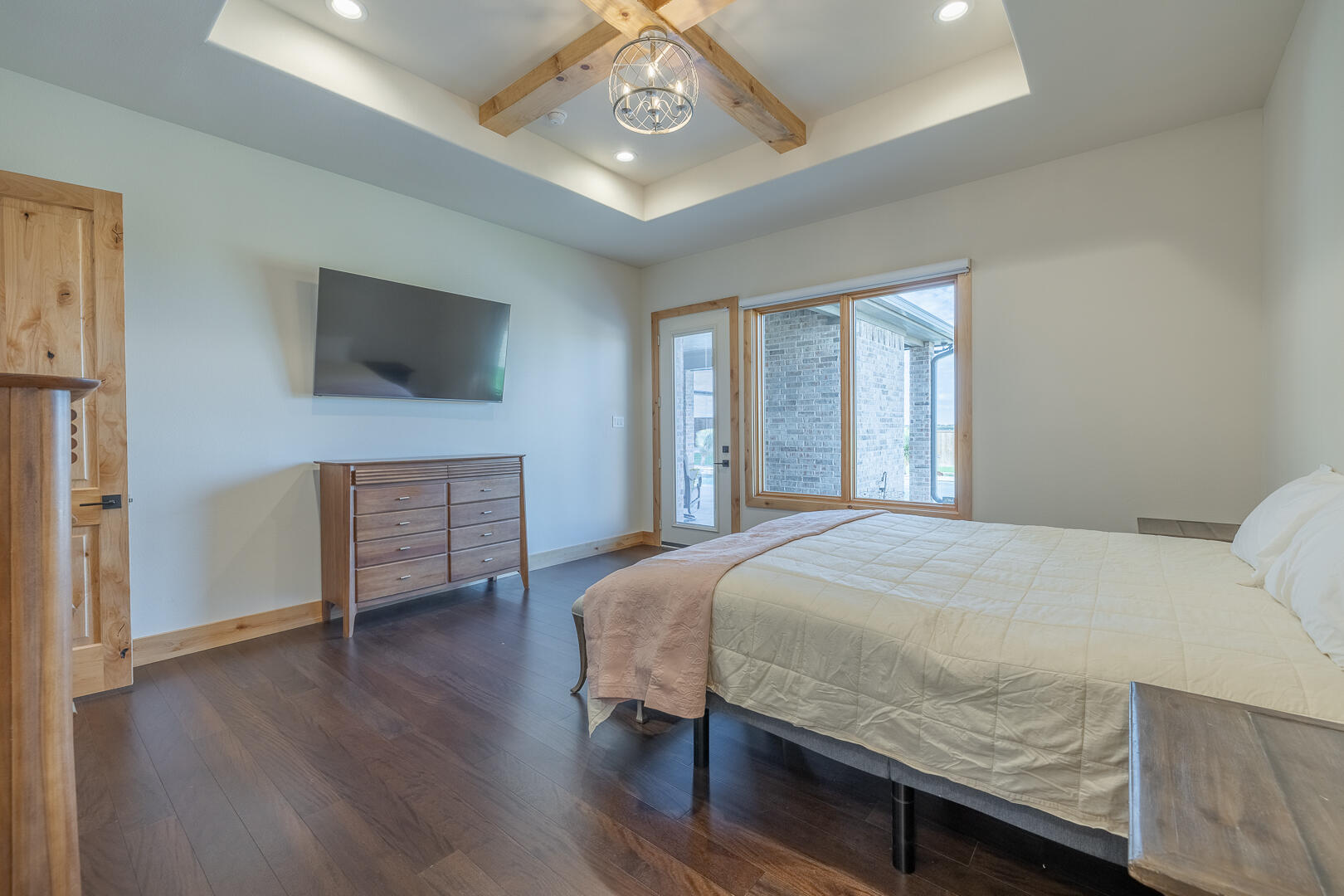 9018 County Road 6850 Lubbock, TX 79407 - Photo 62 of 103 a bedroom with a bed and a flat screen tv