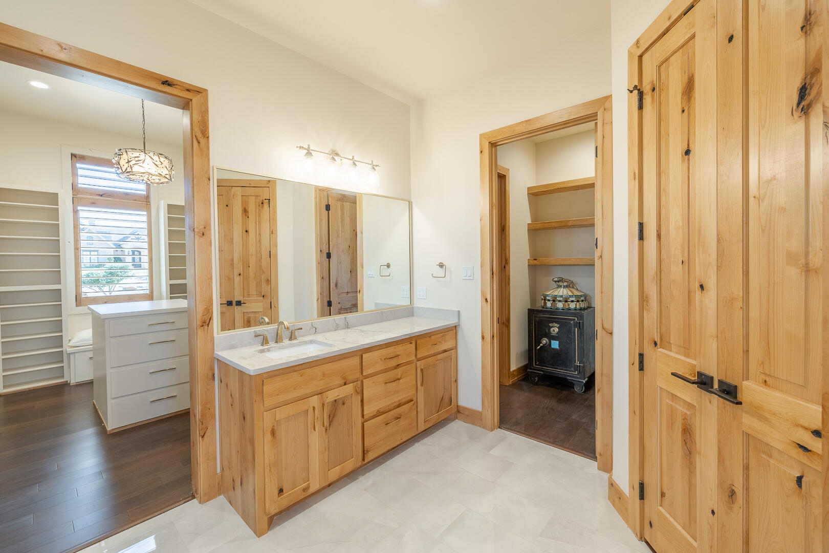 9018 County Road 6850 Lubbock, TX 79407 - Photo 66 of 103 a bathroom with a double vanity sink a mirror and a shower