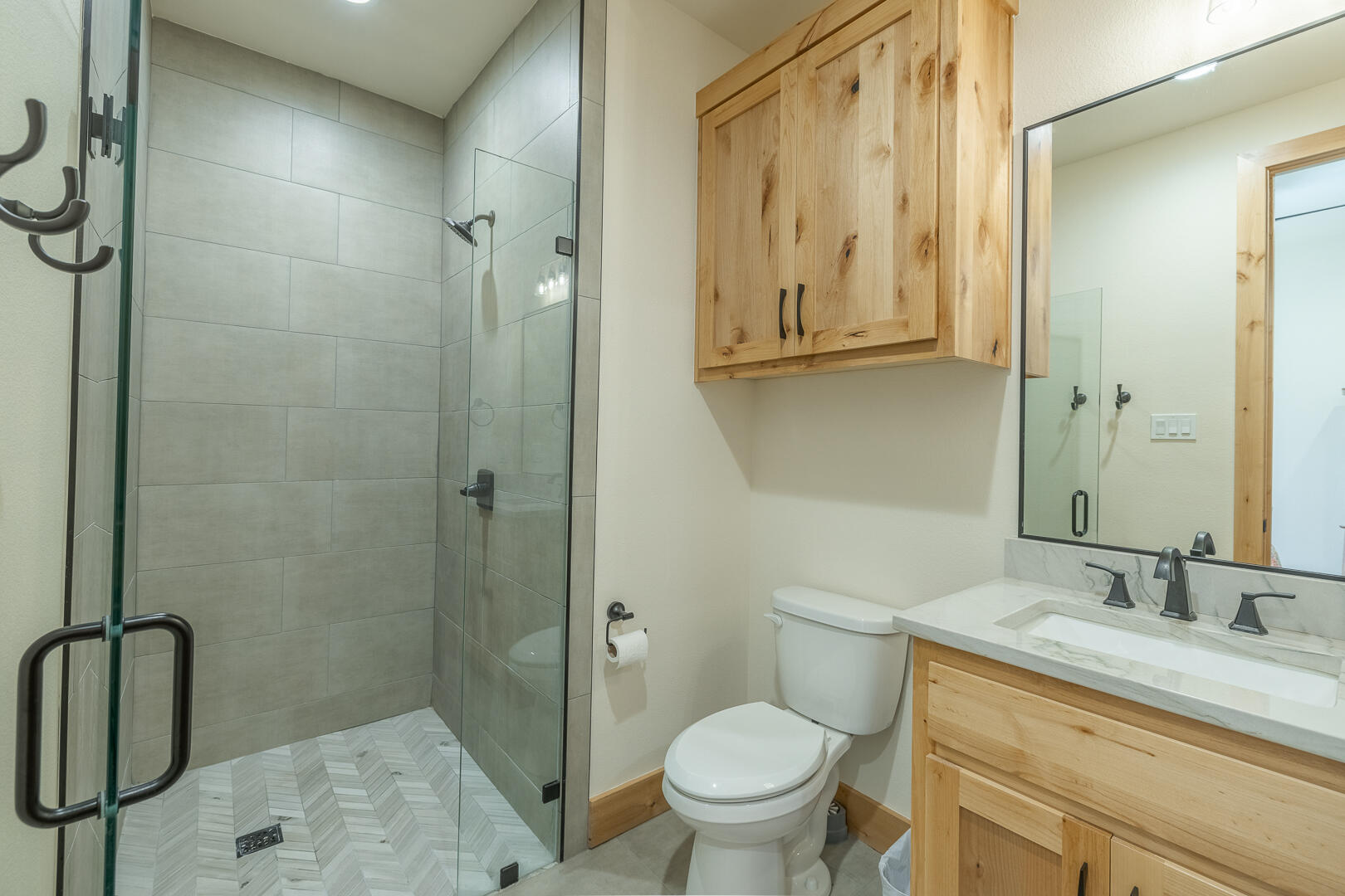 9018 County Road 6850 Lubbock, TX 79407 - Photo 78 of 103 a bathroom with a granite countertop sink toilet and shower