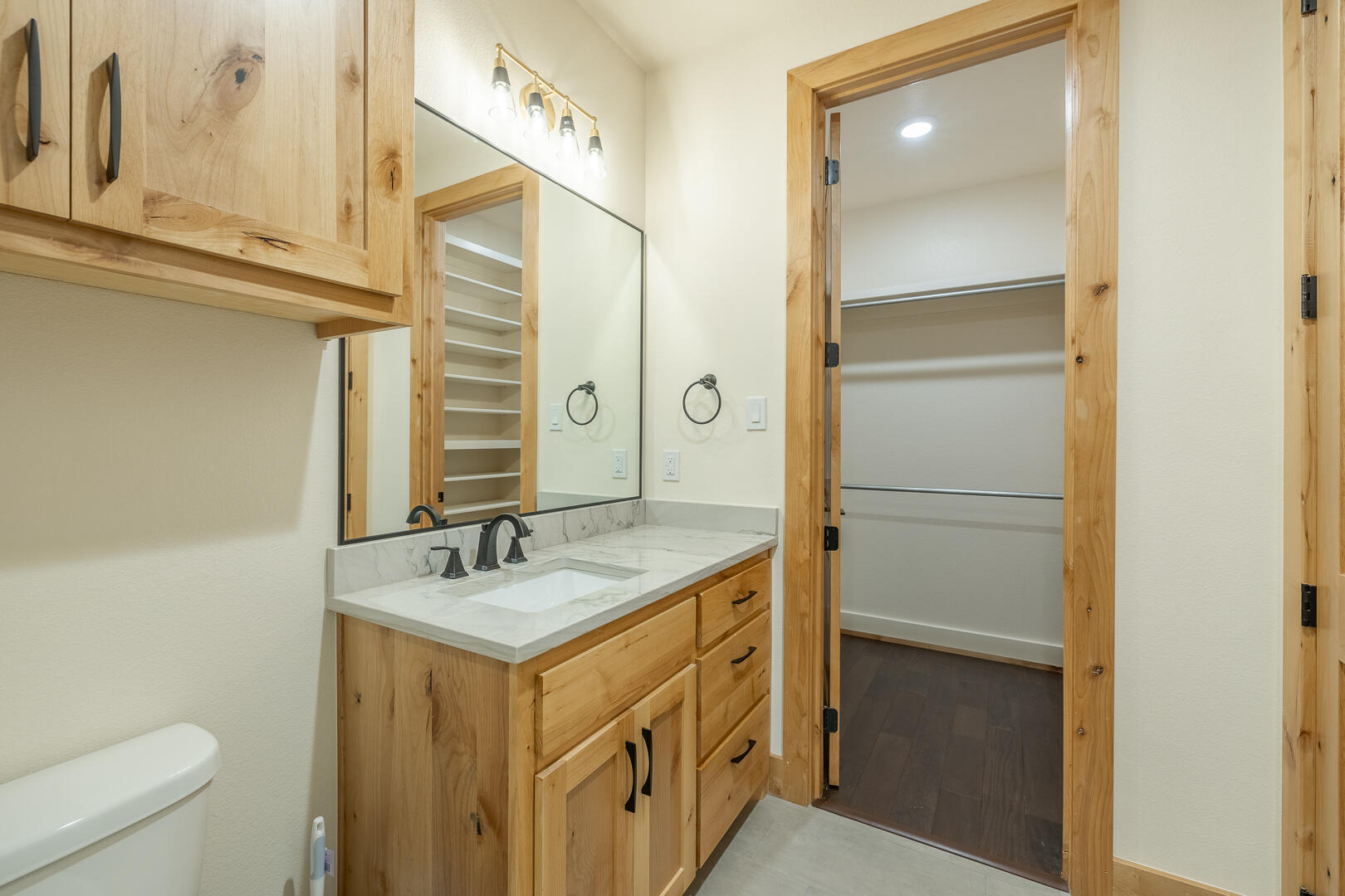 9018 County Road 6850 Lubbock, TX 79407 - Photo 79 of 103 a bathroom with a sink and a mirror