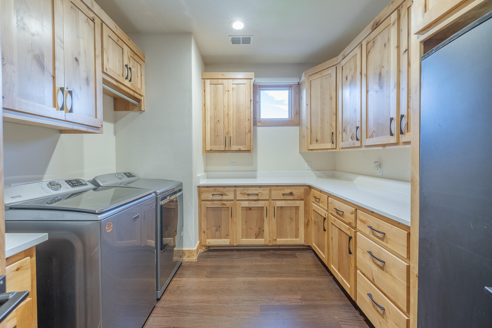 9018 County Road 6850 Lubbock, TX 79407 - Photo 81 of 103 a kitchen with granite countertop cabinets stainless steel appliances a sink and a window
